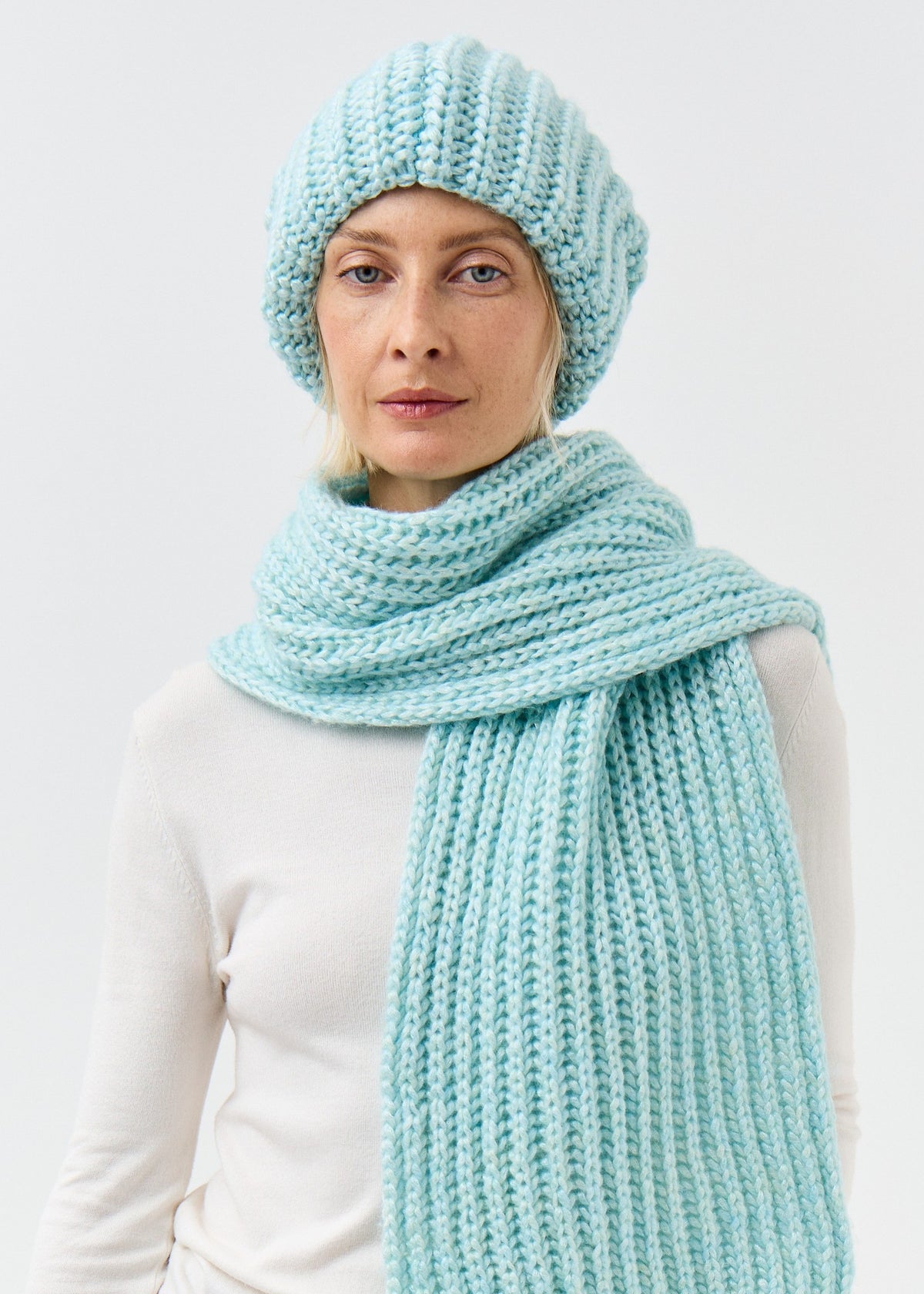 Lustre Blue Melange alpaca-wool scarf: Front portrait wrapped at the neck; beanie sold separately