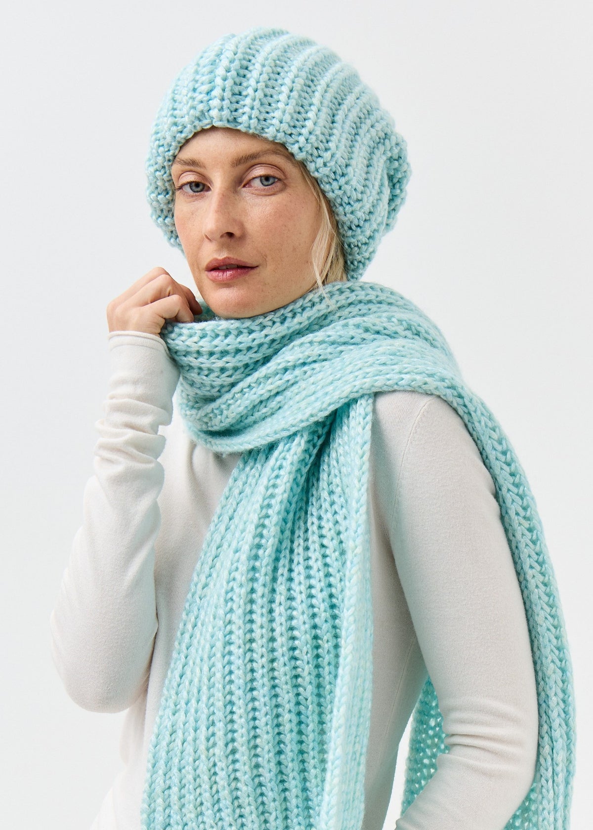 Lustre Blue Melange alpaca-wool scarf: Three-quarter close-up wrapped at the neck; beanie sold separately
