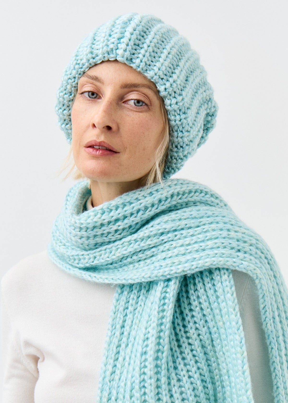 Lustre Blue Melange alpaca-wool scarf: Front close-up of the wrapped scarf; beanie sold separately