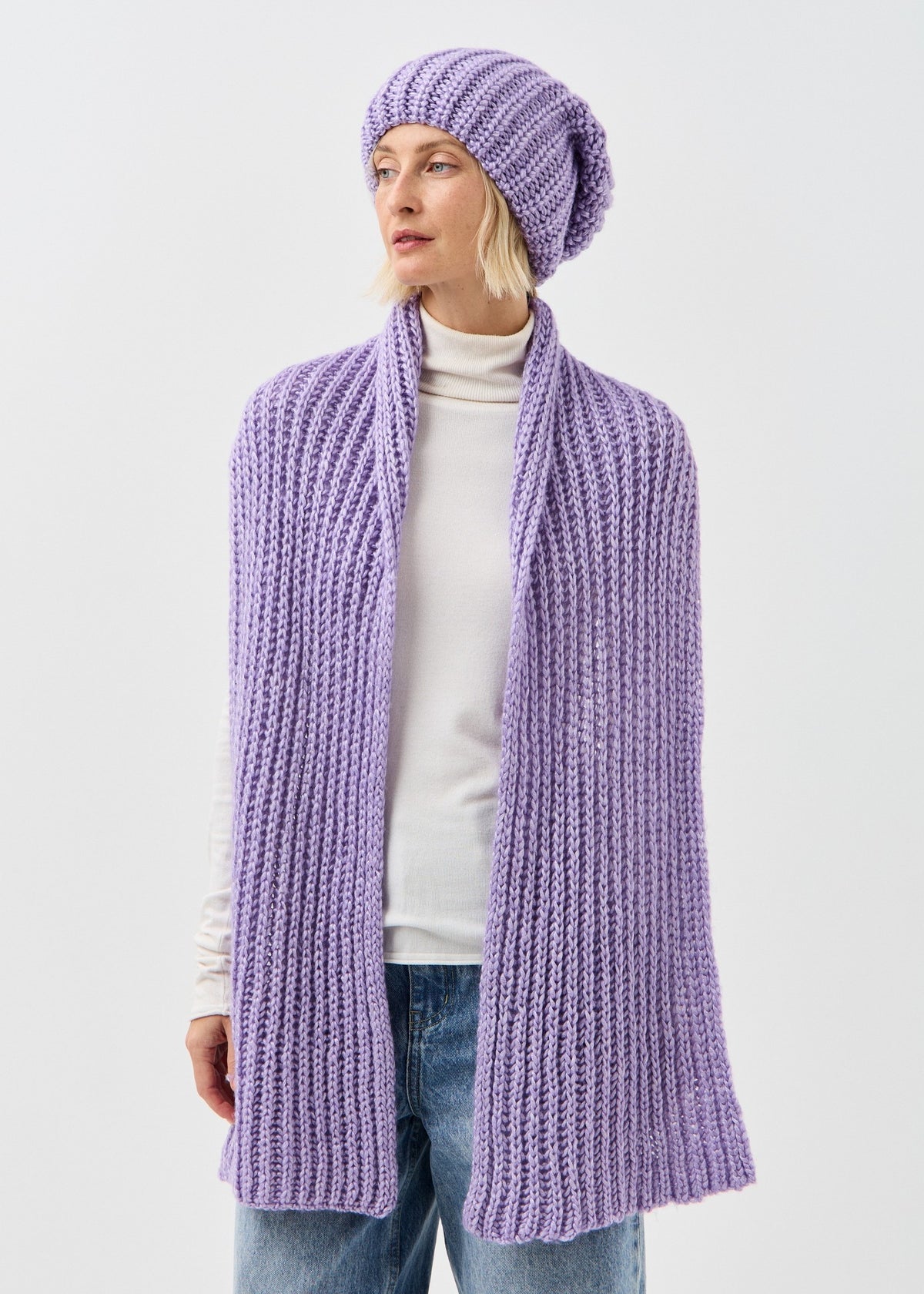 Lustre Violet Melange alpaca-wool scarf: Side outfit view with scarf hanging down; beanie sold separately