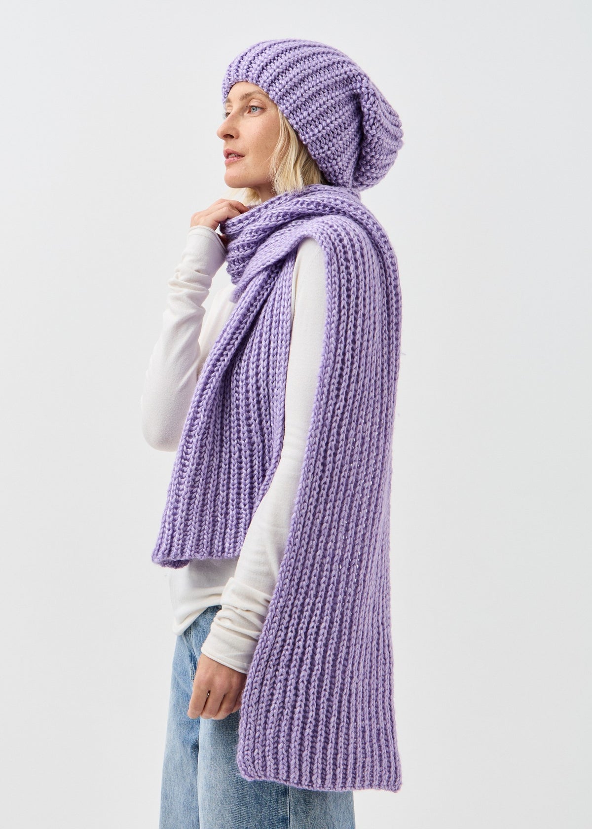 Lustre Violet Melange alpaca-wool scarf: Side portrait wrapped at the neck; beanie sold separately