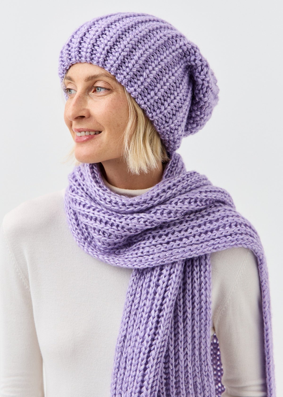 Lustre Violet Melange alpaca-wool scarf: Smiling three-quarter close-up; beanie sold separately