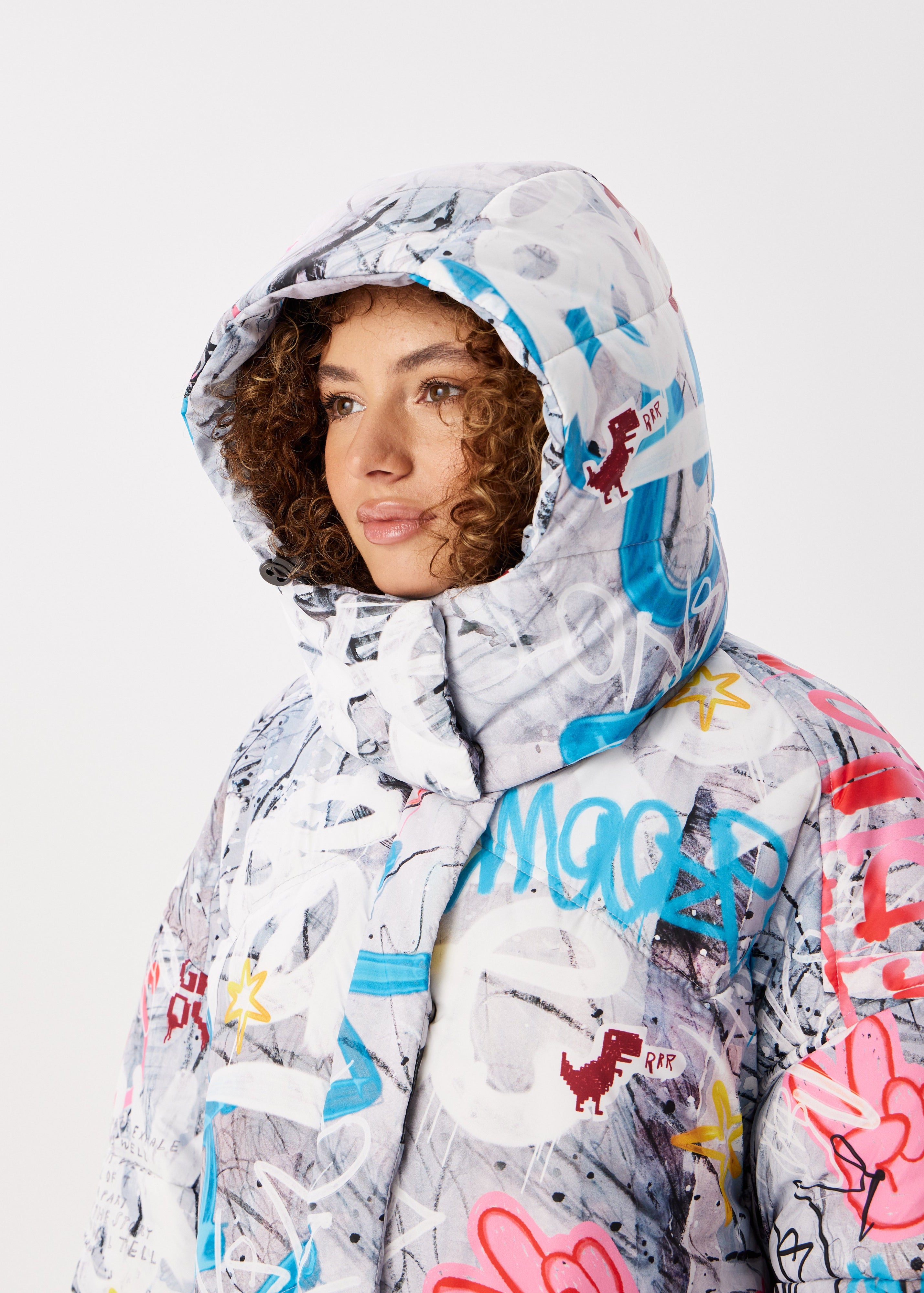 Graffity Printed Puffer Jacket for Women – Artistic & Cozy Design
