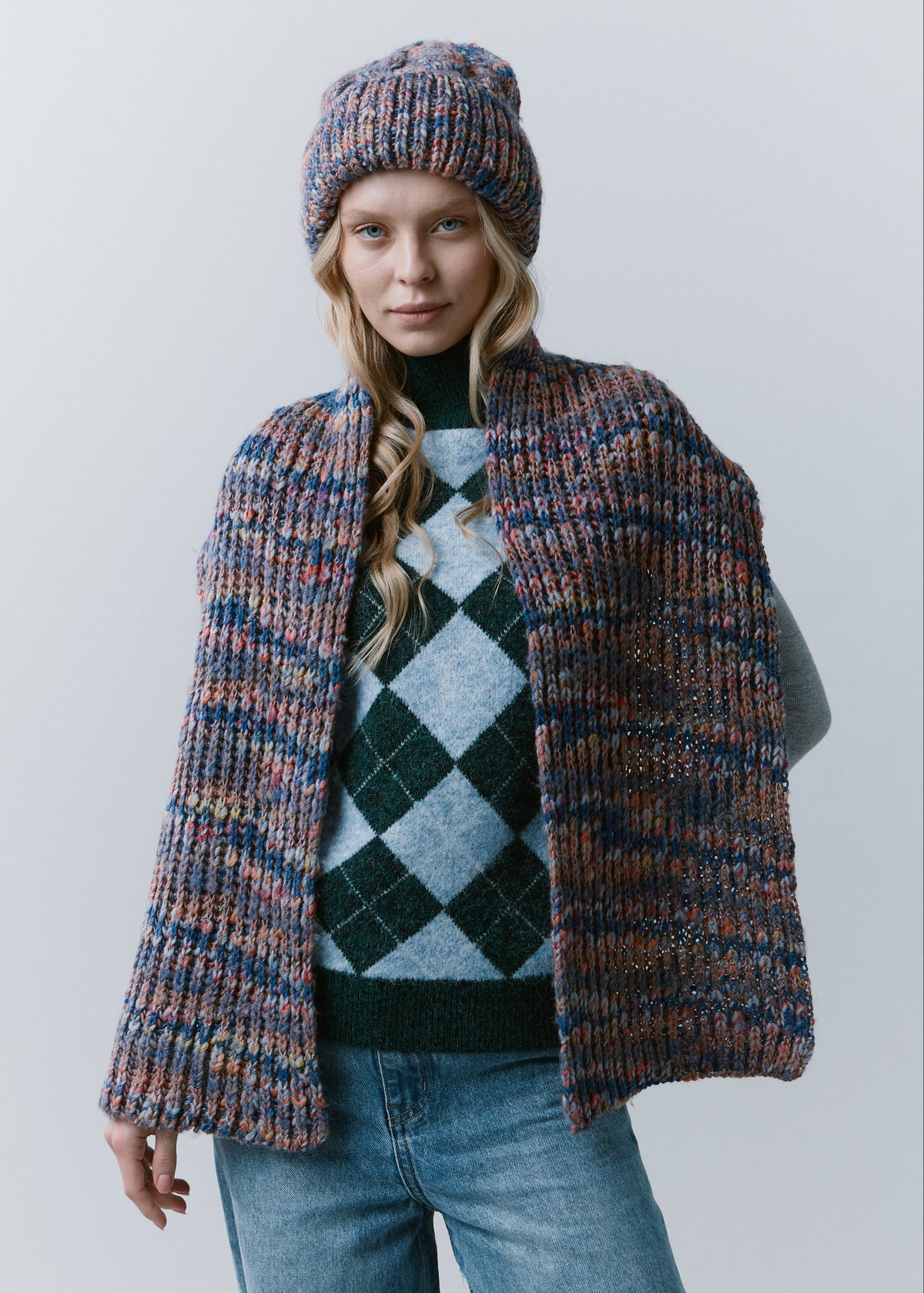Tokyo Pink and Blue cable knit wool beanie: Outfit view with matching scarf draped over shoulders, sold separately