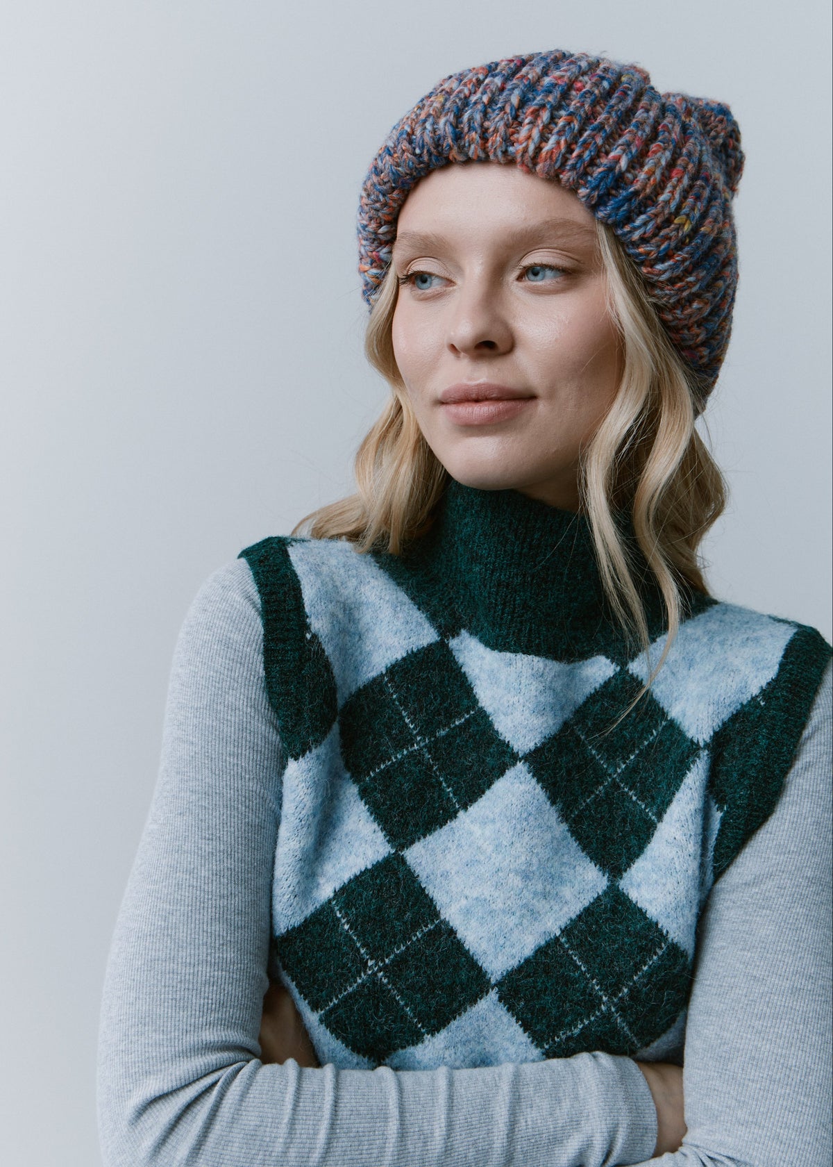 Tokyo Pink and Blue cable knit wool beanie: Three-quarter outfit view with folded cuff