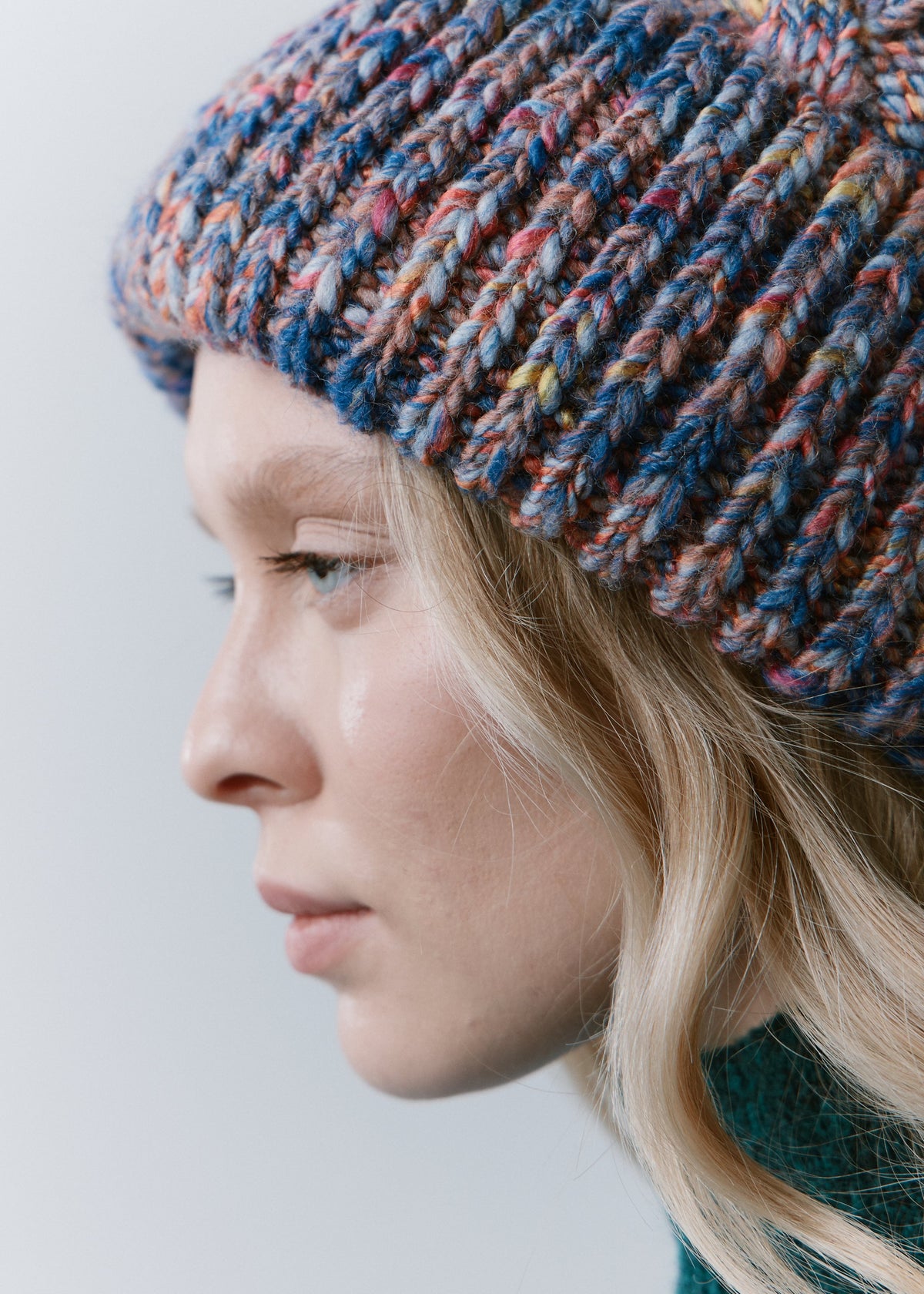 Tokyo Pink and Blue cable knit wool beanie: Side close-up of the mixed yarn and ribbed cuff