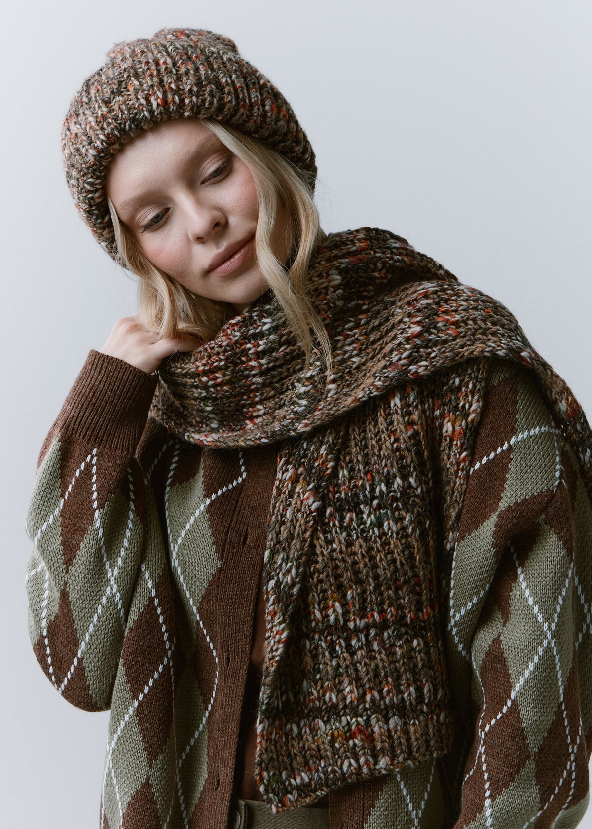 Tokyo Multicolor cable knit wool beanie: Three-quarter portrait with matching scarf, sold separately