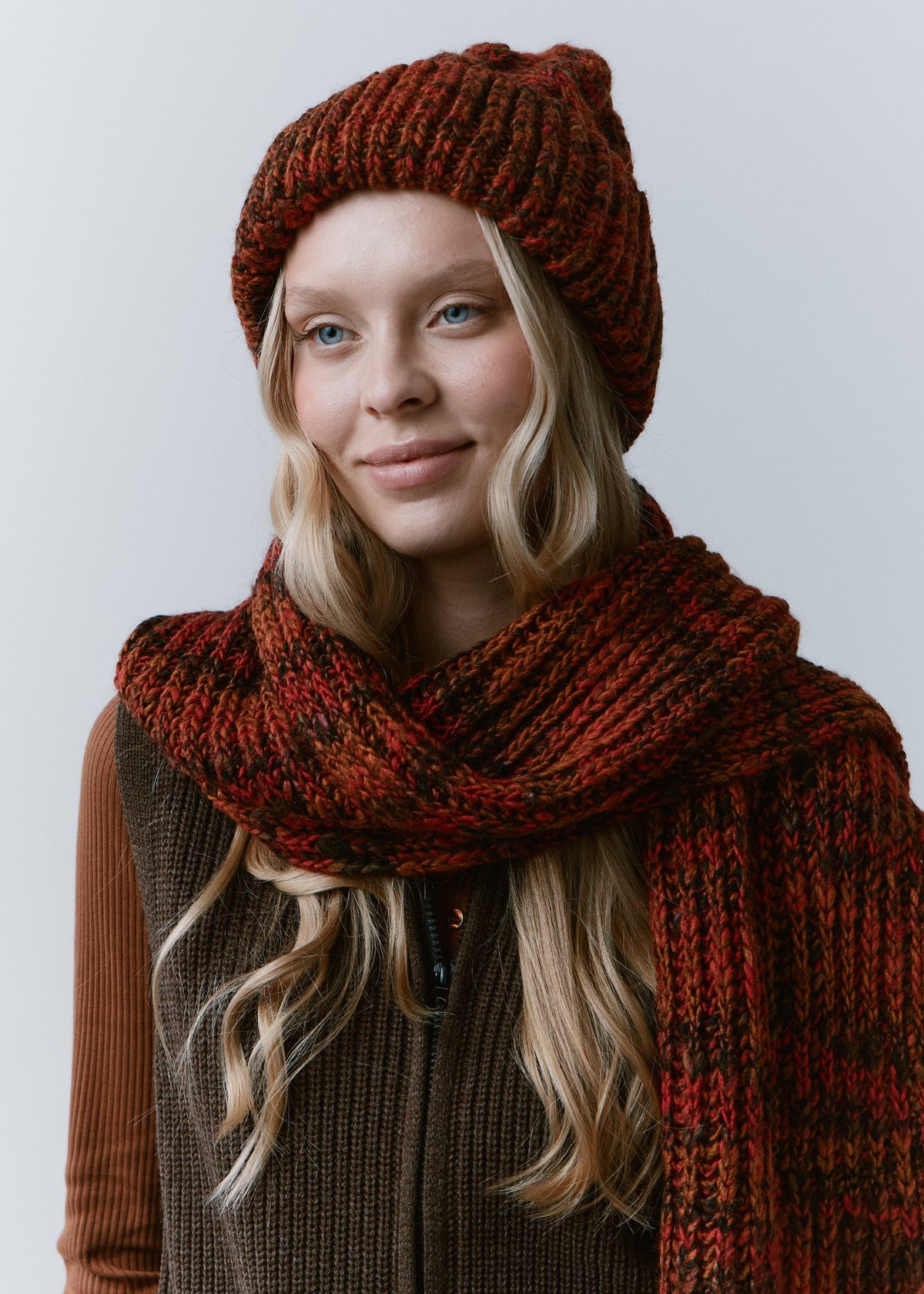 Tokyo Brown cable knit wool beanie: Front view with matching scarf wrapped around the neck, sold separately