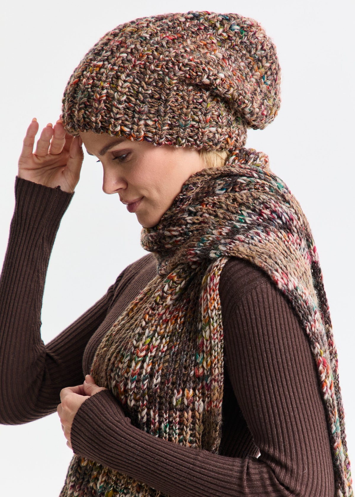 Oversized Multicolor double-layer wool hat: Side view with a hand at the brim and matching scarf, sold separately