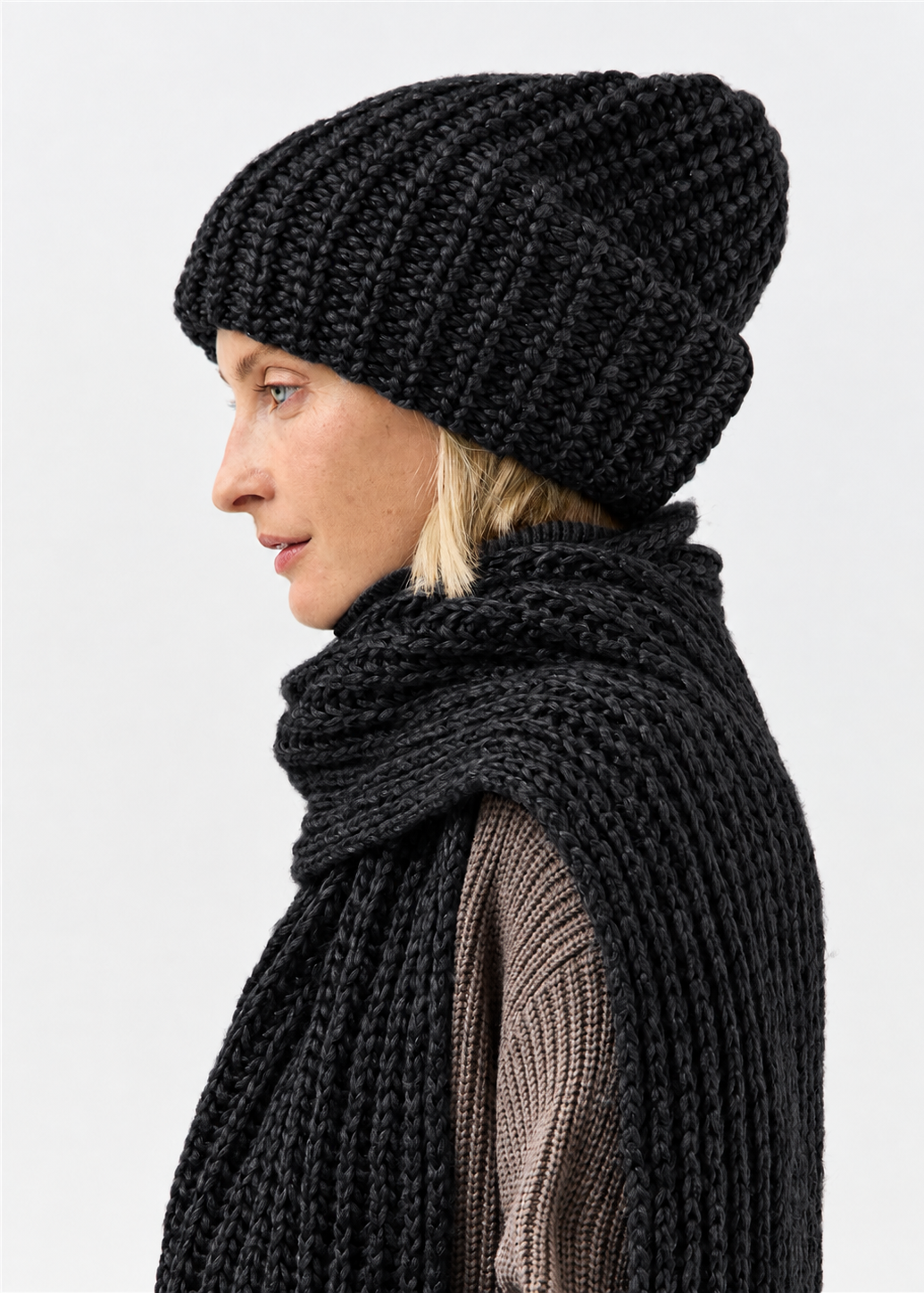 Lustre Black Melange alpaca-wool scarf: Side profile showing scarf over the shoulder; beanie sold separately