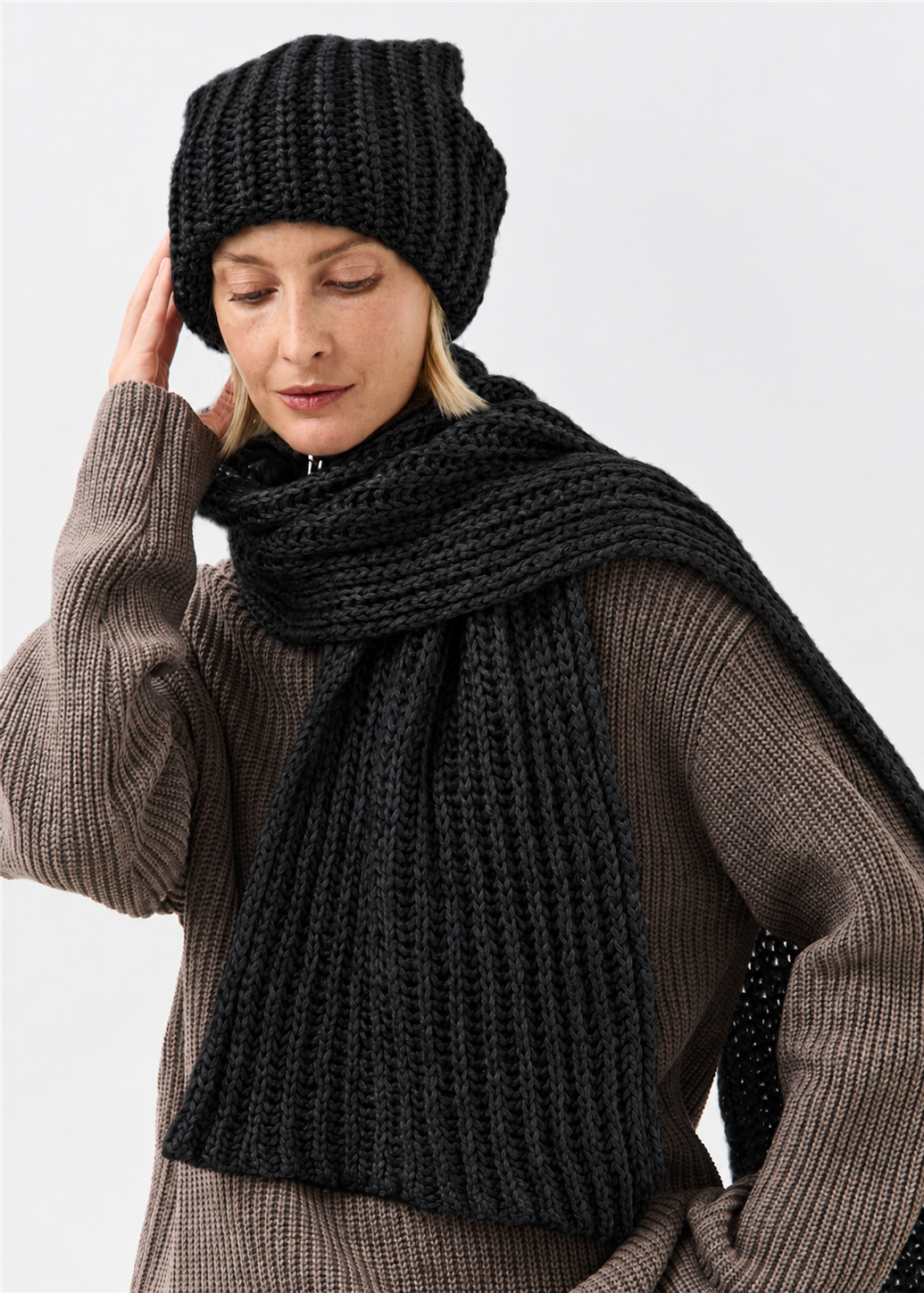 Lustre Black Melange alpaca-wool scarf: Looking-down portrait wrapped around the neck; beanie sold separately