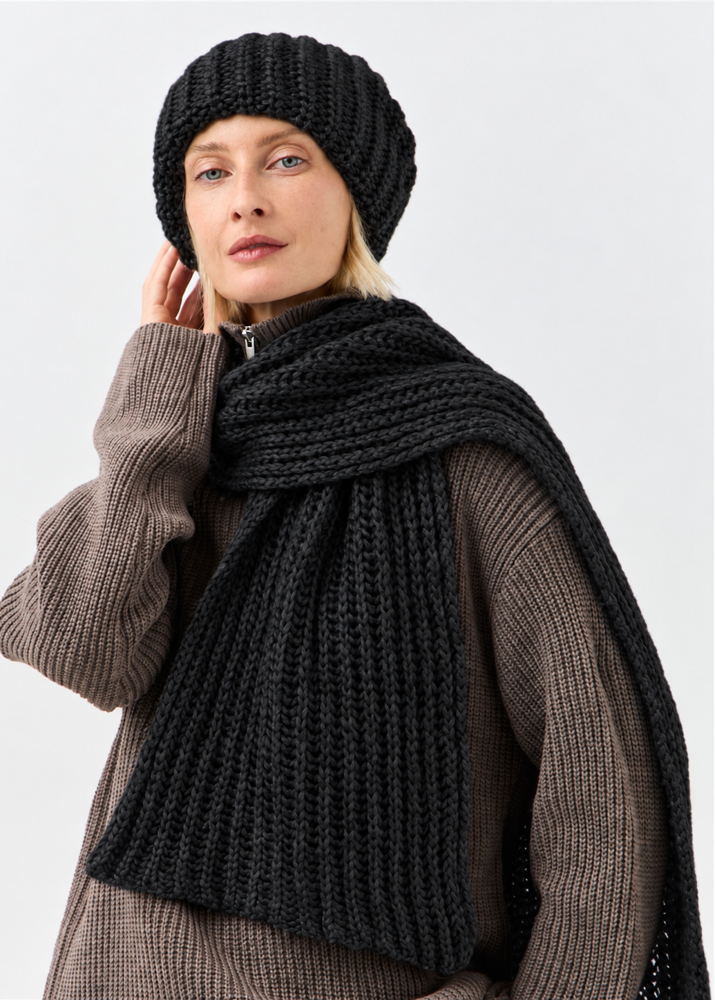 Lustre Black Melange alpaca-wool scarf: Outfit portrait showing the long ribbed end; beanie sold separately