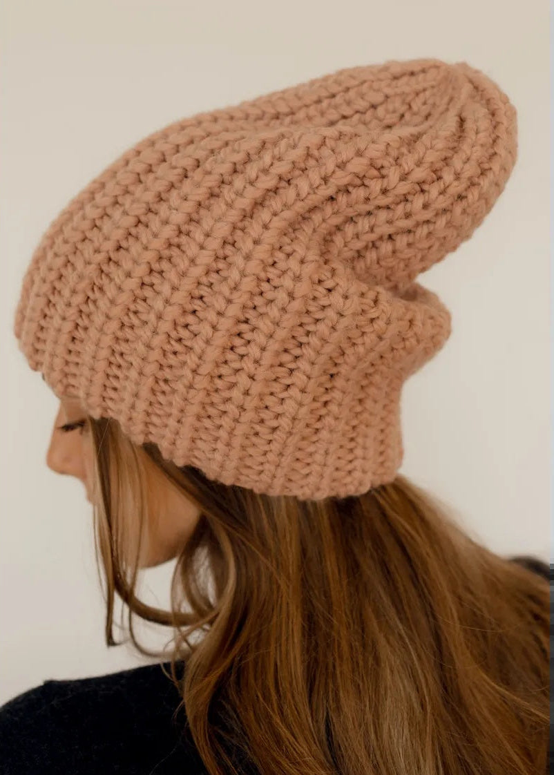 BRIKOLY London Peach knit beanie shown close up from the rear side.
